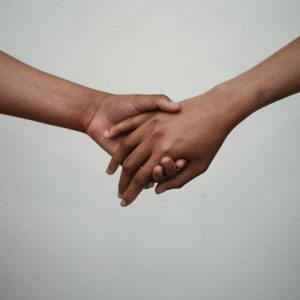 persons-hand-on-white-surface-gdsv6uopb1u